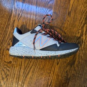New Balance Fresh Foam Crag TR White and Black with Orange Accents